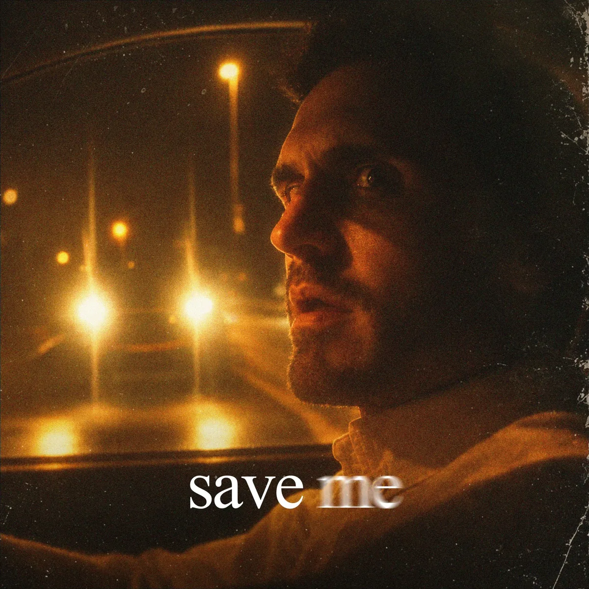 Save Me artwork: a man lit by amber streetlights through a car window at night